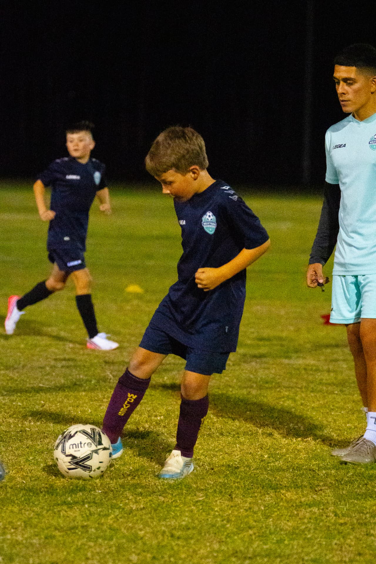 NextGen player working on close control with a coach
